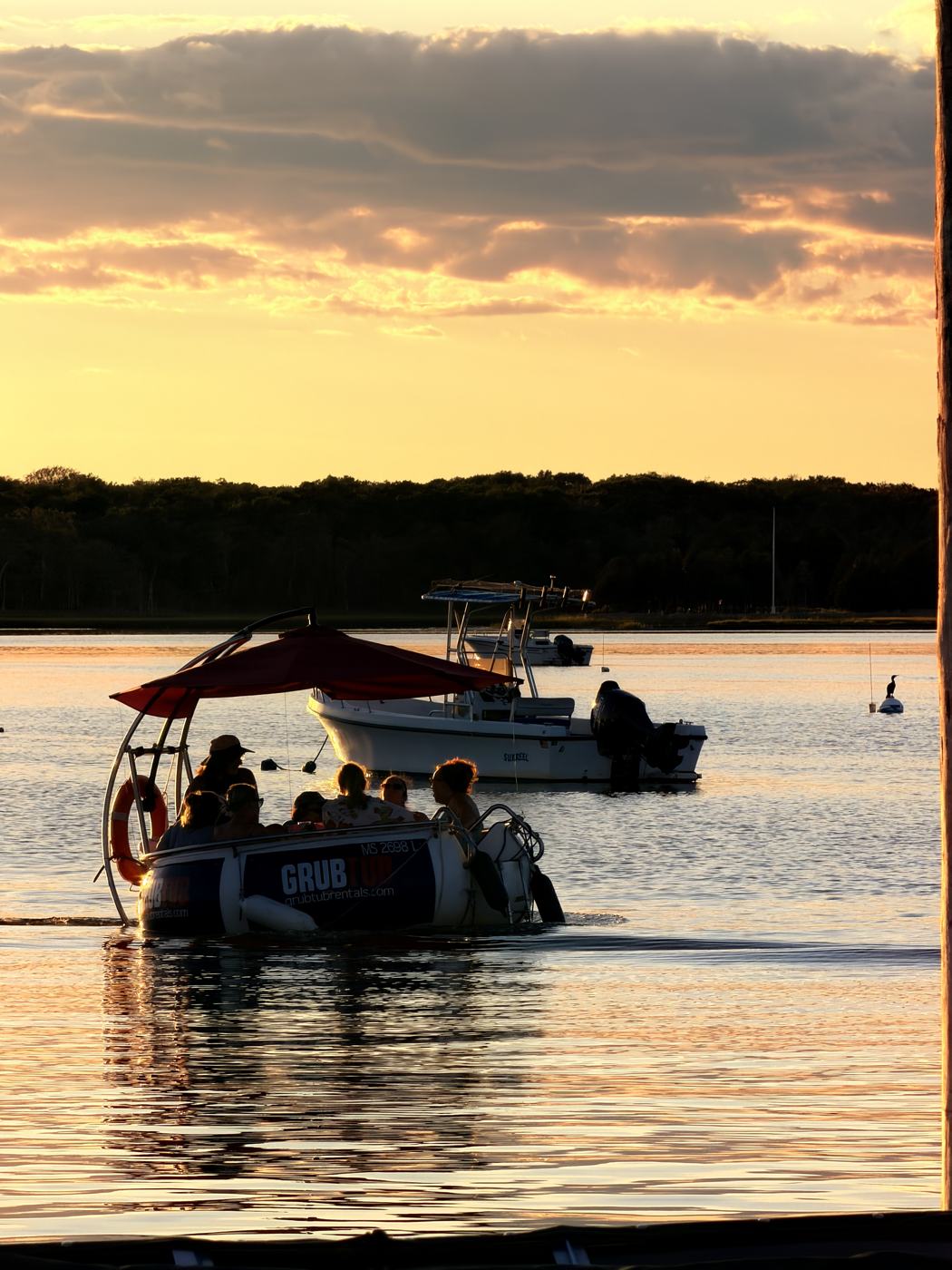 A GrubTub on Padanaram Harbor at sunset
